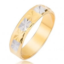 Sjajni zlatni i srebrni prsten sa uzorkom dijamanta