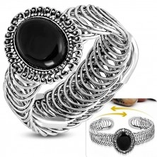 Gipka čelična narukvica - ovalni ornament sa crnim kamenom, spirala